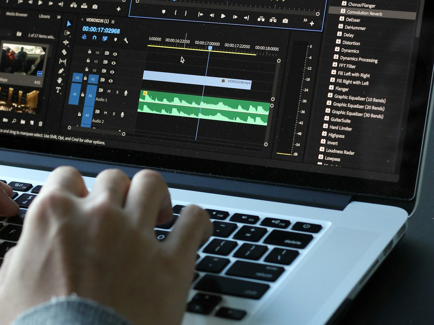 person using MacBook pro turned on